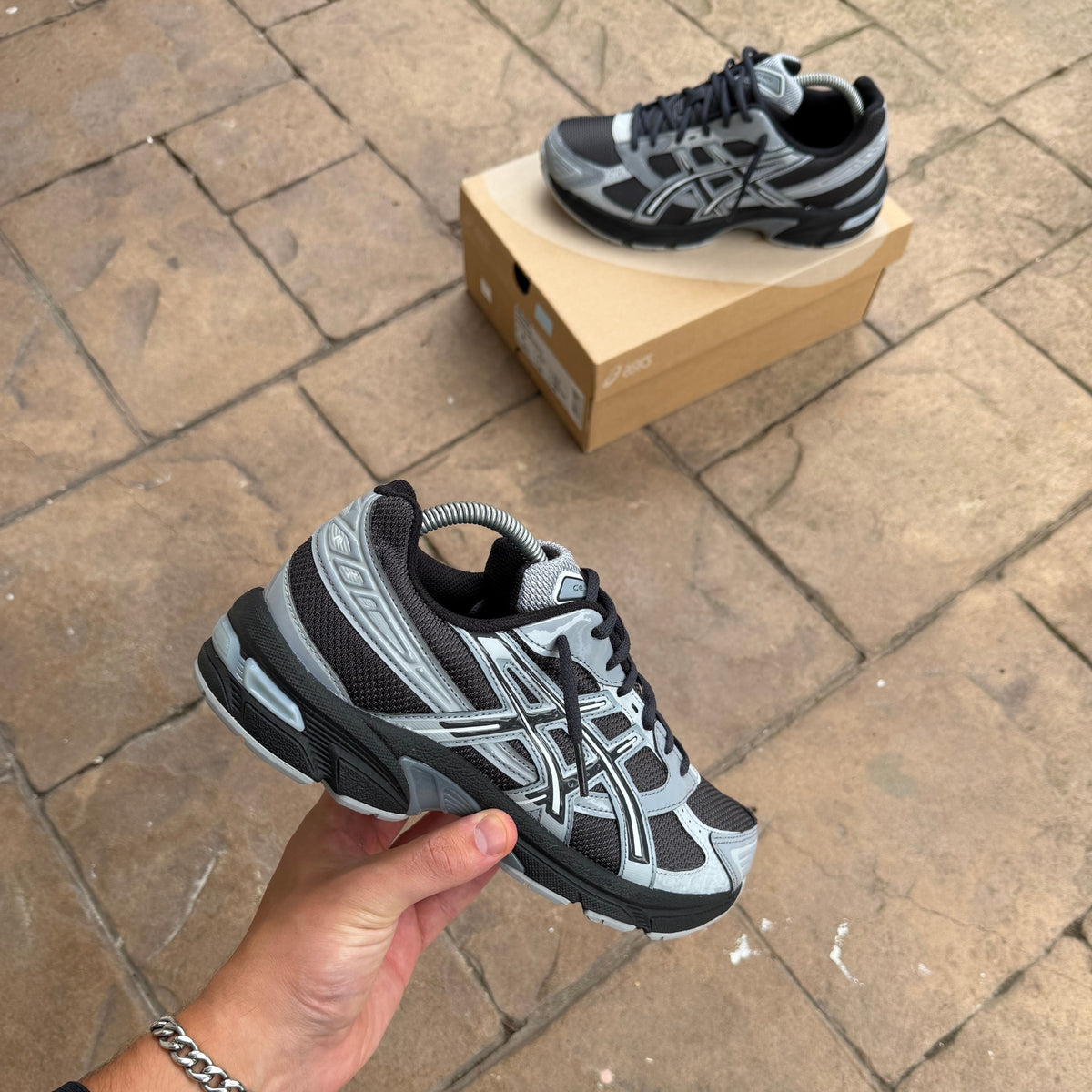 ASICS Gel-1130 Graphite Grey Gravel trainer close-up