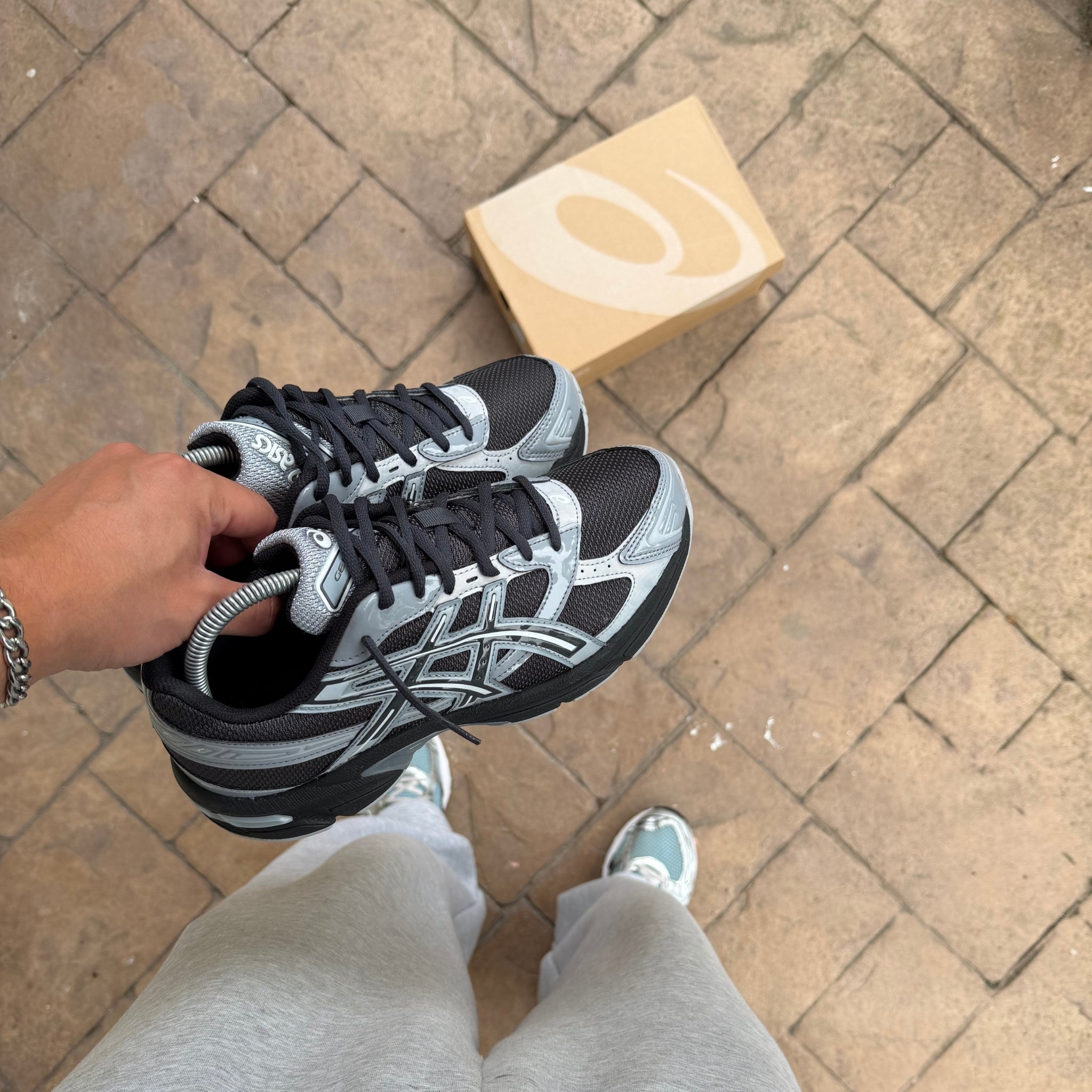 Pair of ASICS Gel-1130 Graphite Grey Gravel trainers