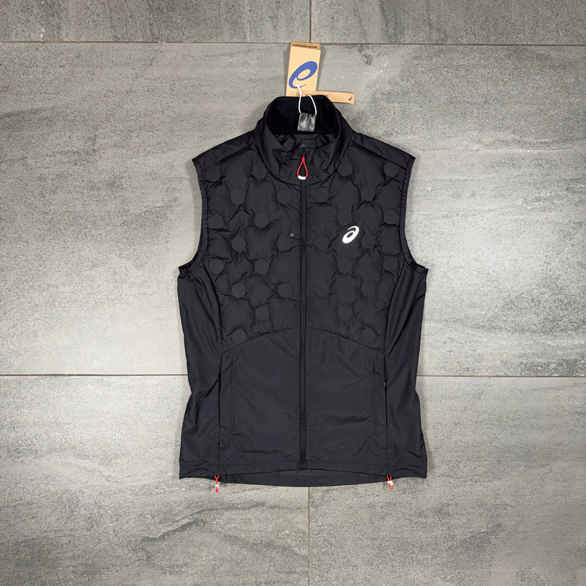 Black ASICS Run Gilet laid flat showing the quilted upper design, full zip and ASICS chest branding