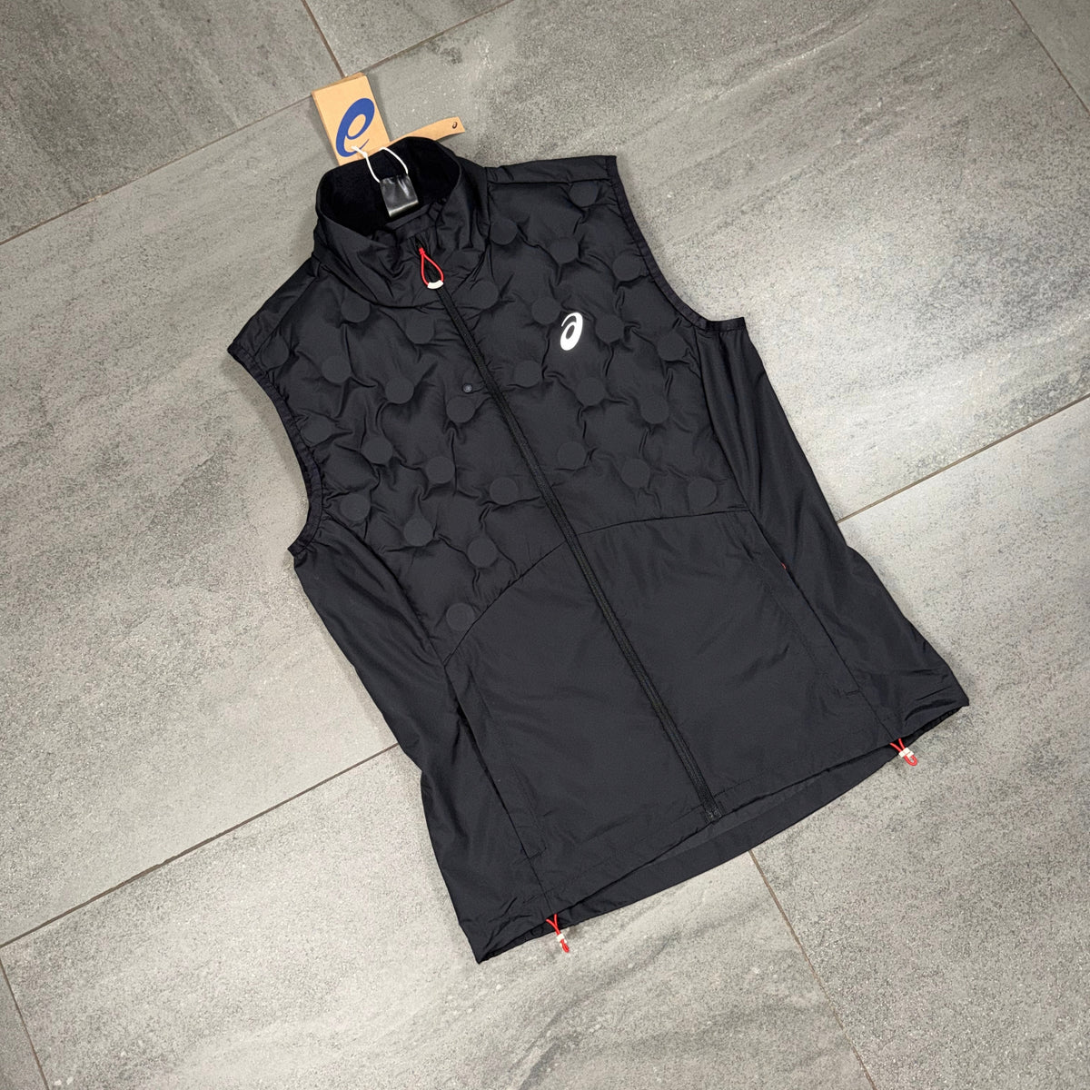 Men's ASICS Run Gilet in black laid flat showing the full-length zip and lightweight athletic construction