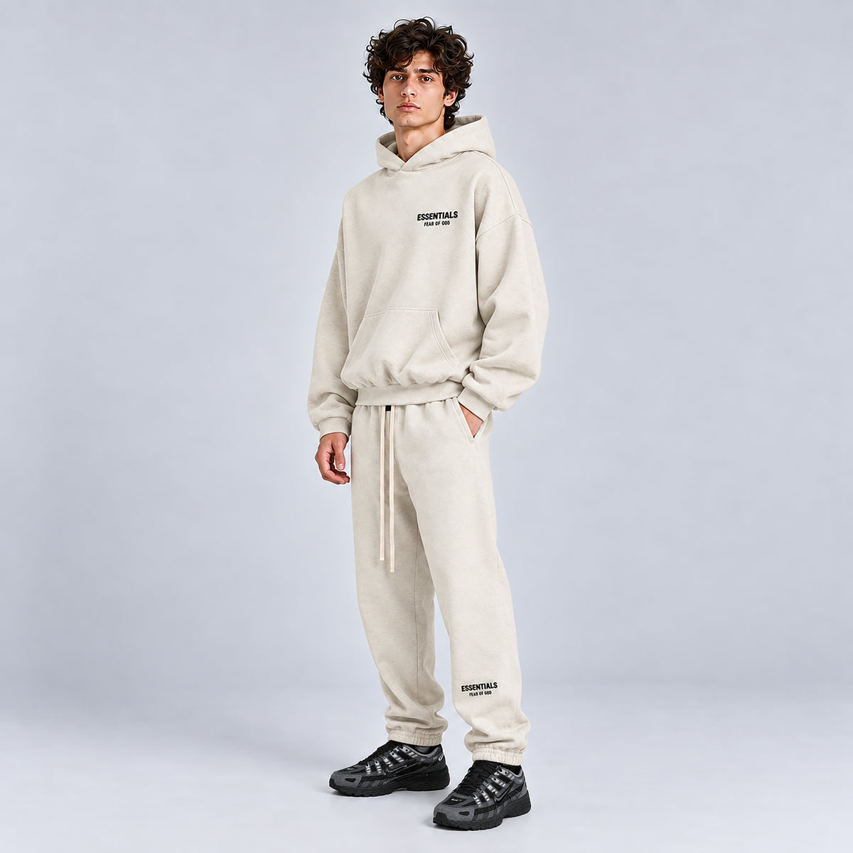 Side view of Fear of God Essentials Light Heather Oatmeal SS22 sweatpants
