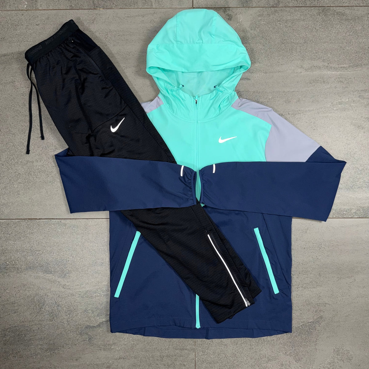 Nike Hyper Turquoise Windrunner with Phenom pants displayed as a set