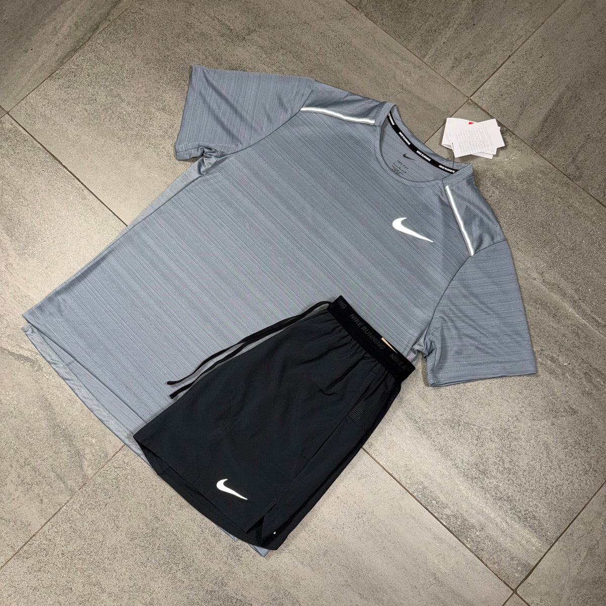 Nike Miler Cool Grey T-Shirt with Black Flex Stride Shorts flat lay