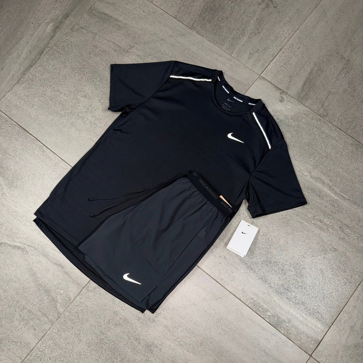 All-black Nike activewear combination featuring a Miler T-shirt and Flex Stride shorts