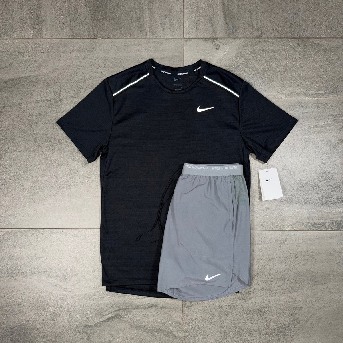 Nike Miler Black T-shirt and grey Flex Stride Shorts displayed together as a men's running set