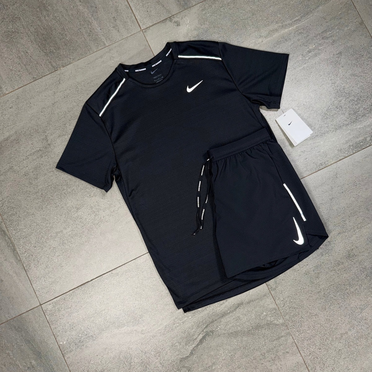 Black Nike Miler T-shirt and OG Flex shorts arranged together as a lightweight training outfit