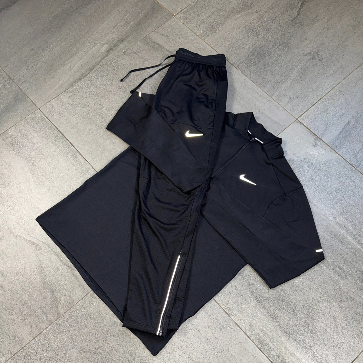 Nike Phenom Pants and Element Black running top displayed together
