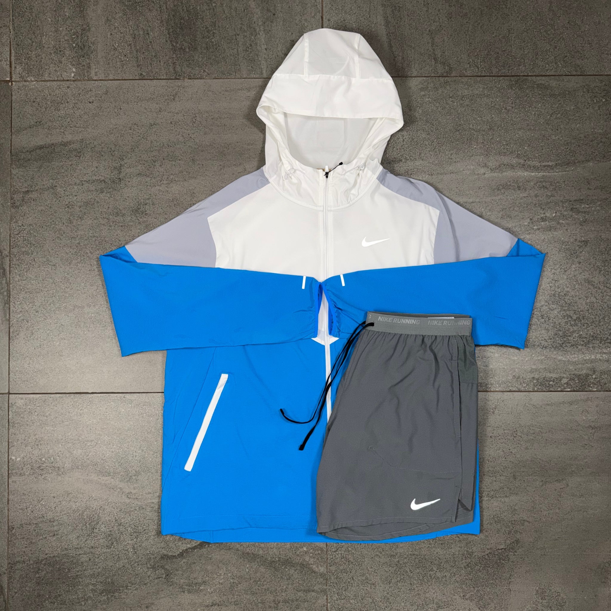 Nike Windrunner with grey Flex Stride shorts displayed as a complete outfit