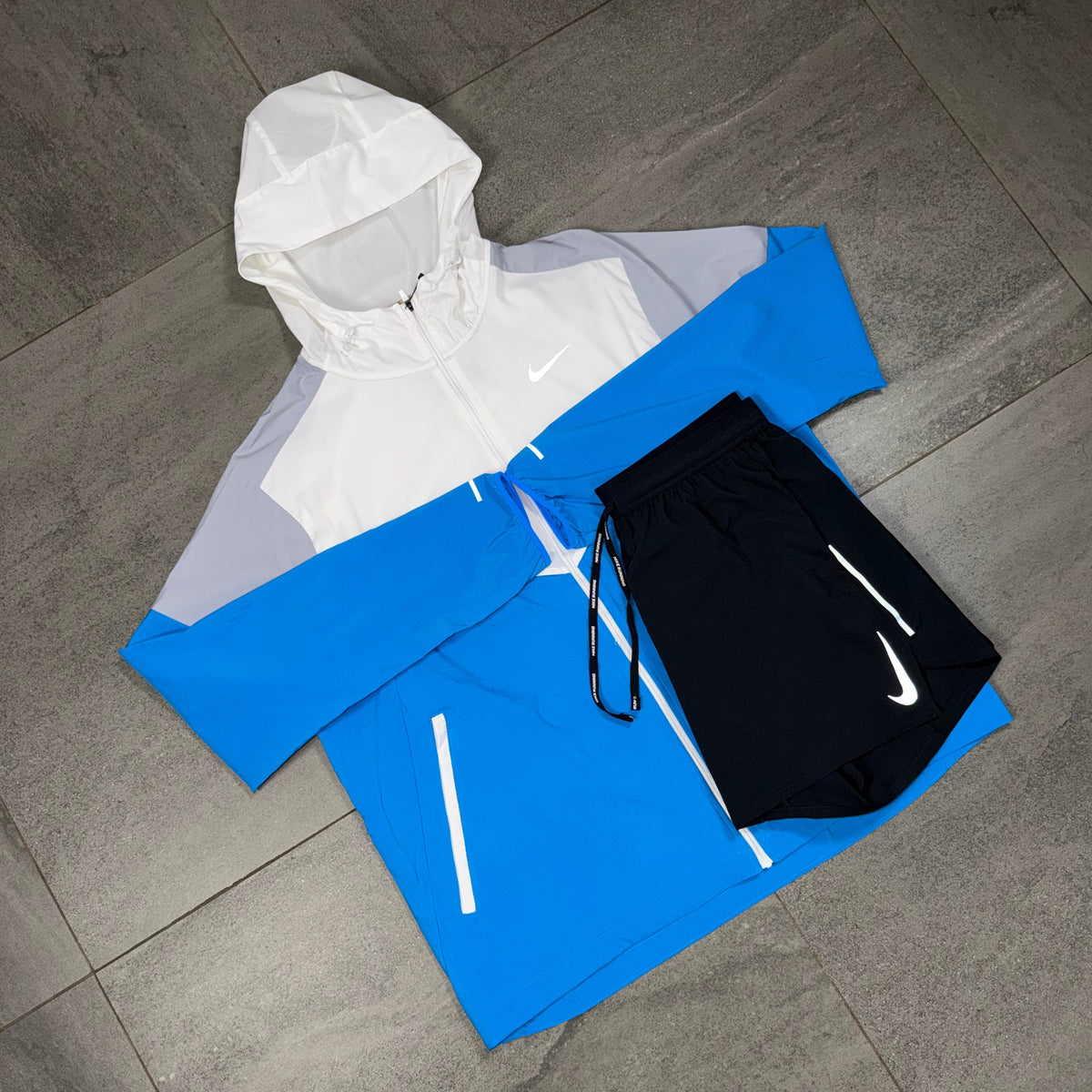 Nike Windrunner activewear outfit paired with black OG Flex training shorts