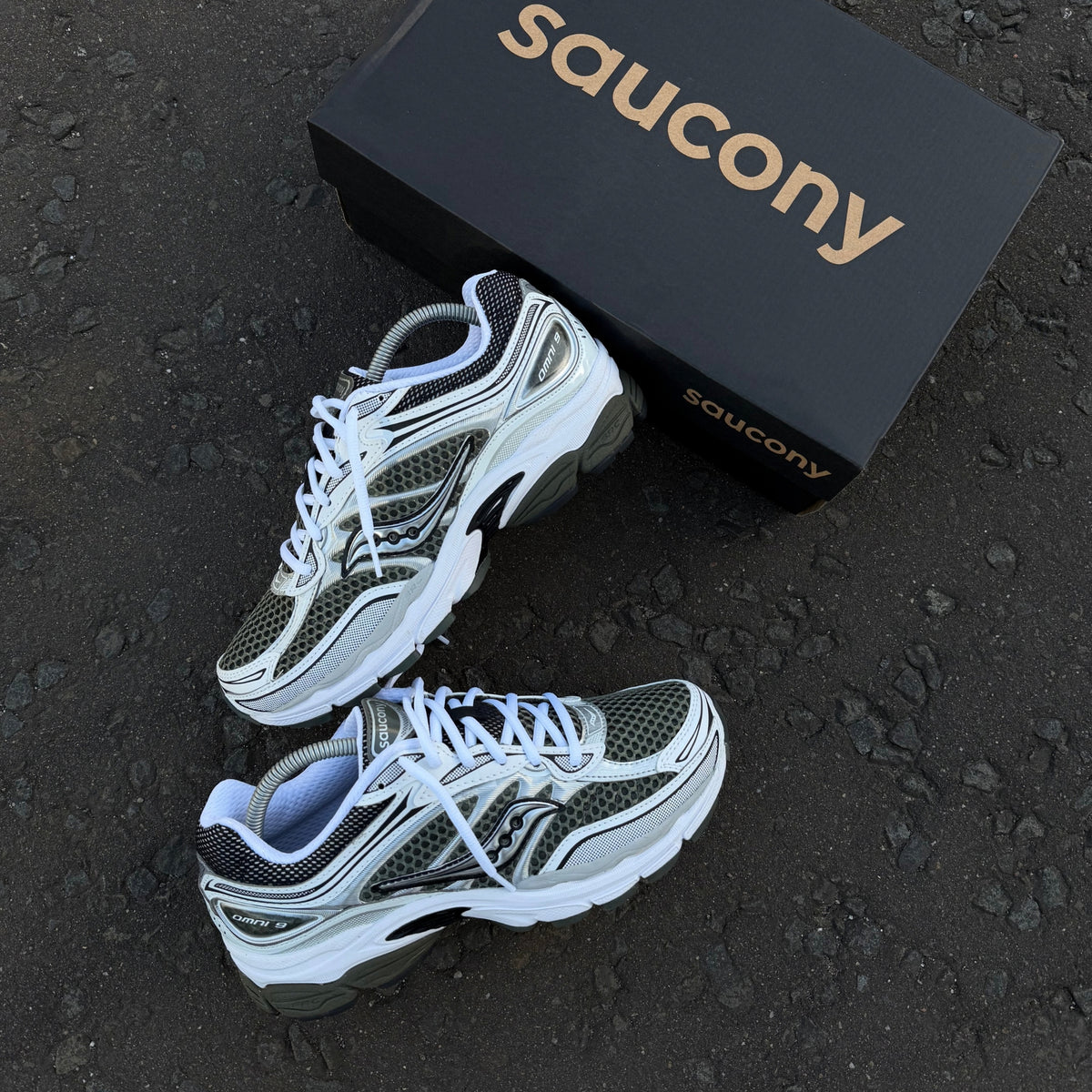 Pair of Saucony ProGrid Omni 9 Fatigue Khaki Green trainers