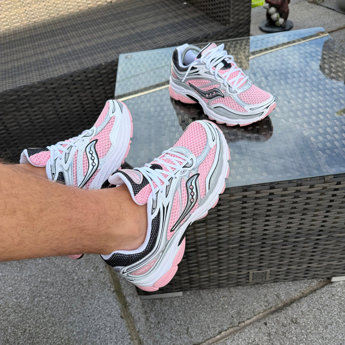 Hand-held view of Saucony ProGrid Omni 9 White Touch trainers
