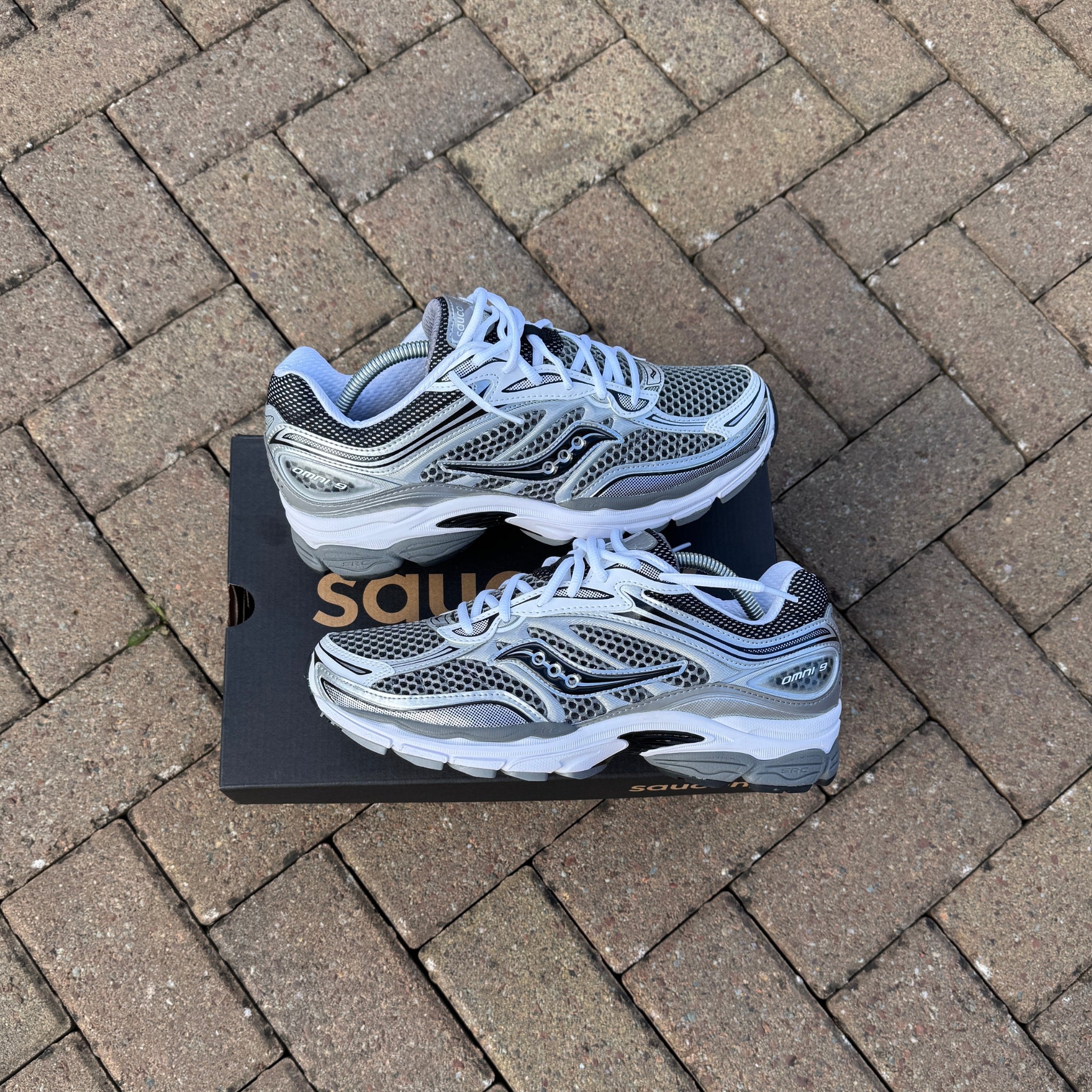 Pair of Saucony ProGrid Omni 9 Silver Grey trainers