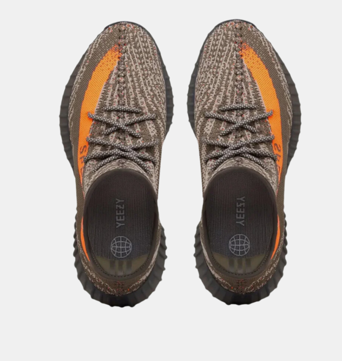 Adidas Yeezy Boost 350 V2 'Carbon Beluga' shoe featuring a dark grey Primeknit upper with black lines and orange speckles, a matching orange stripe with 'SPLY-350' branding on the lateral side, and a ribbed TPU cage on the midsole.