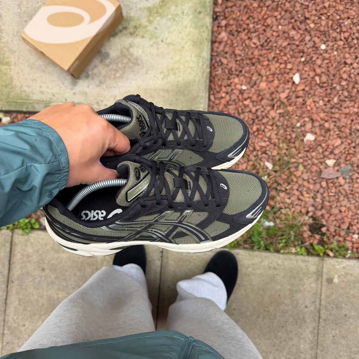 ASICS Gel-1130 Irvine Black trainers on foot