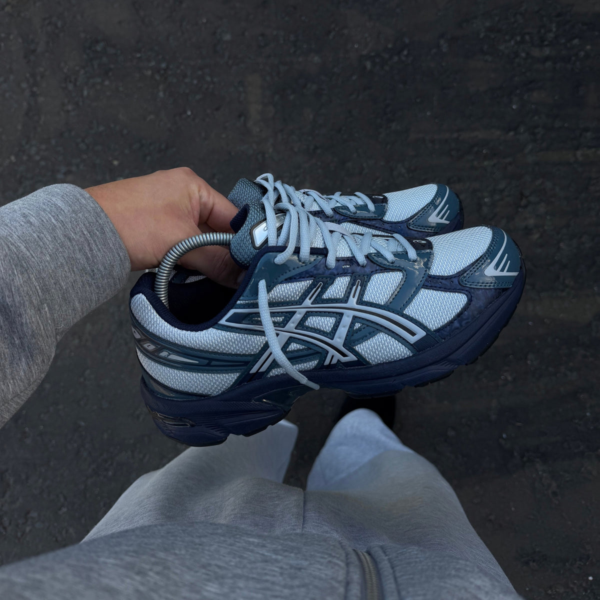 Close-up of ASICS Gel-1130 Piedmont Blue trainer showing the blue colourway and signature ASICS side stripes