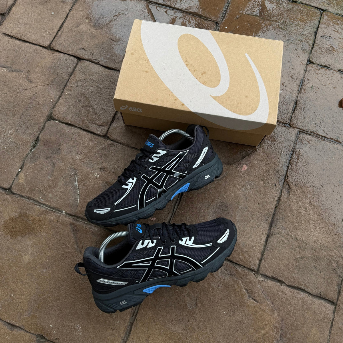 Pair of ASICS Gel-Venture 6 Blue Coast trainers displayed beside ASICS shoe box