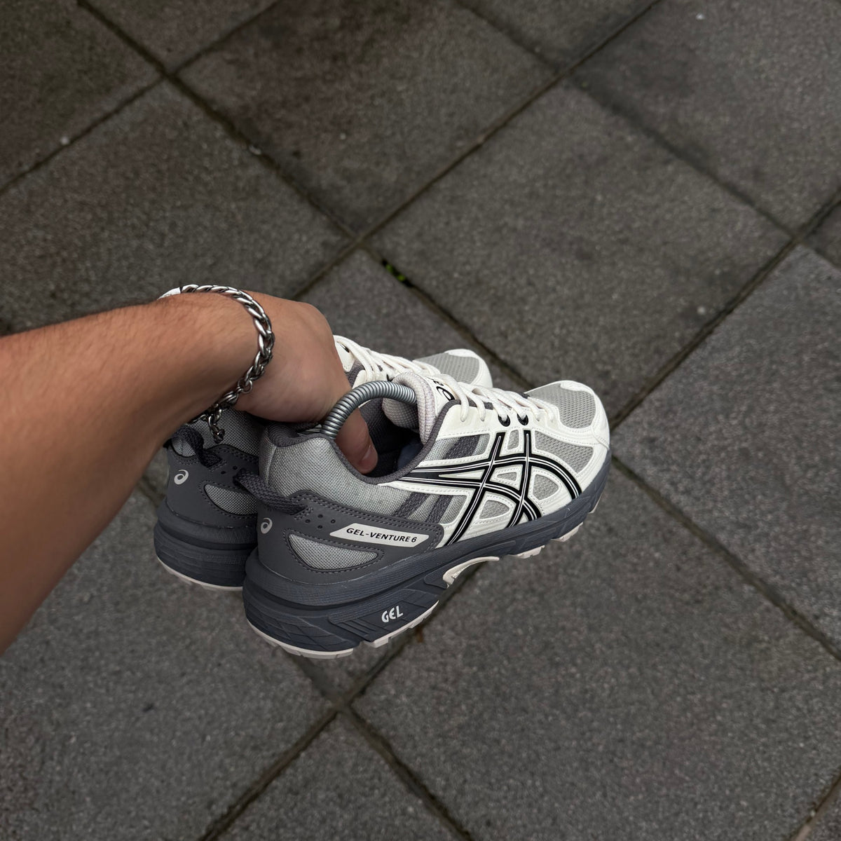 Rear angle of ASICS Gel-Venture 6 Olive Grey Cream trainer showing grey heel construction and GEL cushioning