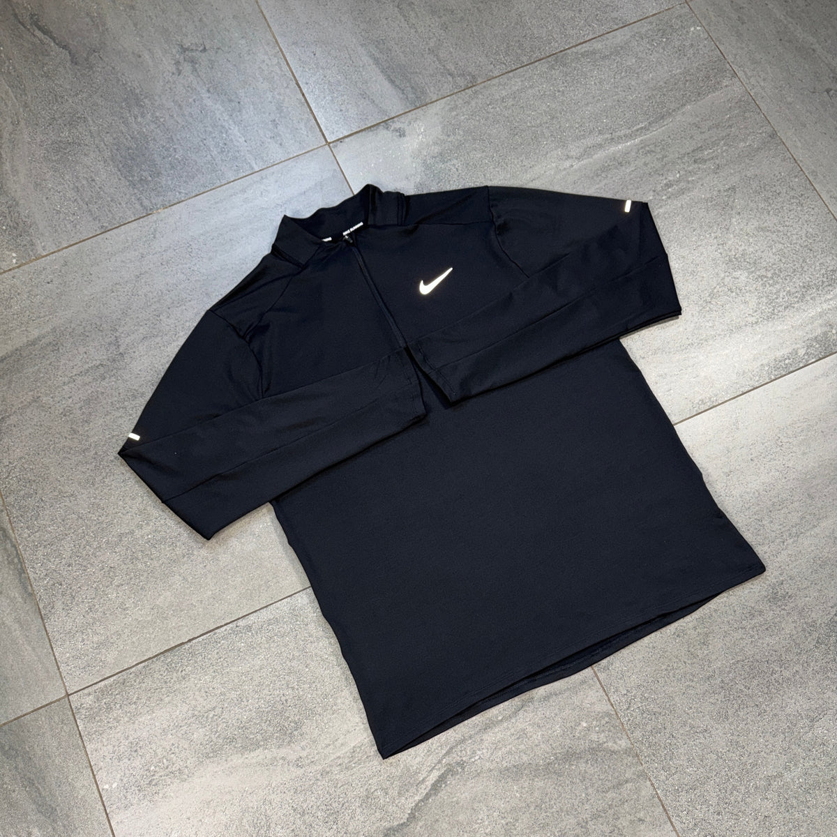 Black Nike Element running top with white Swoosh