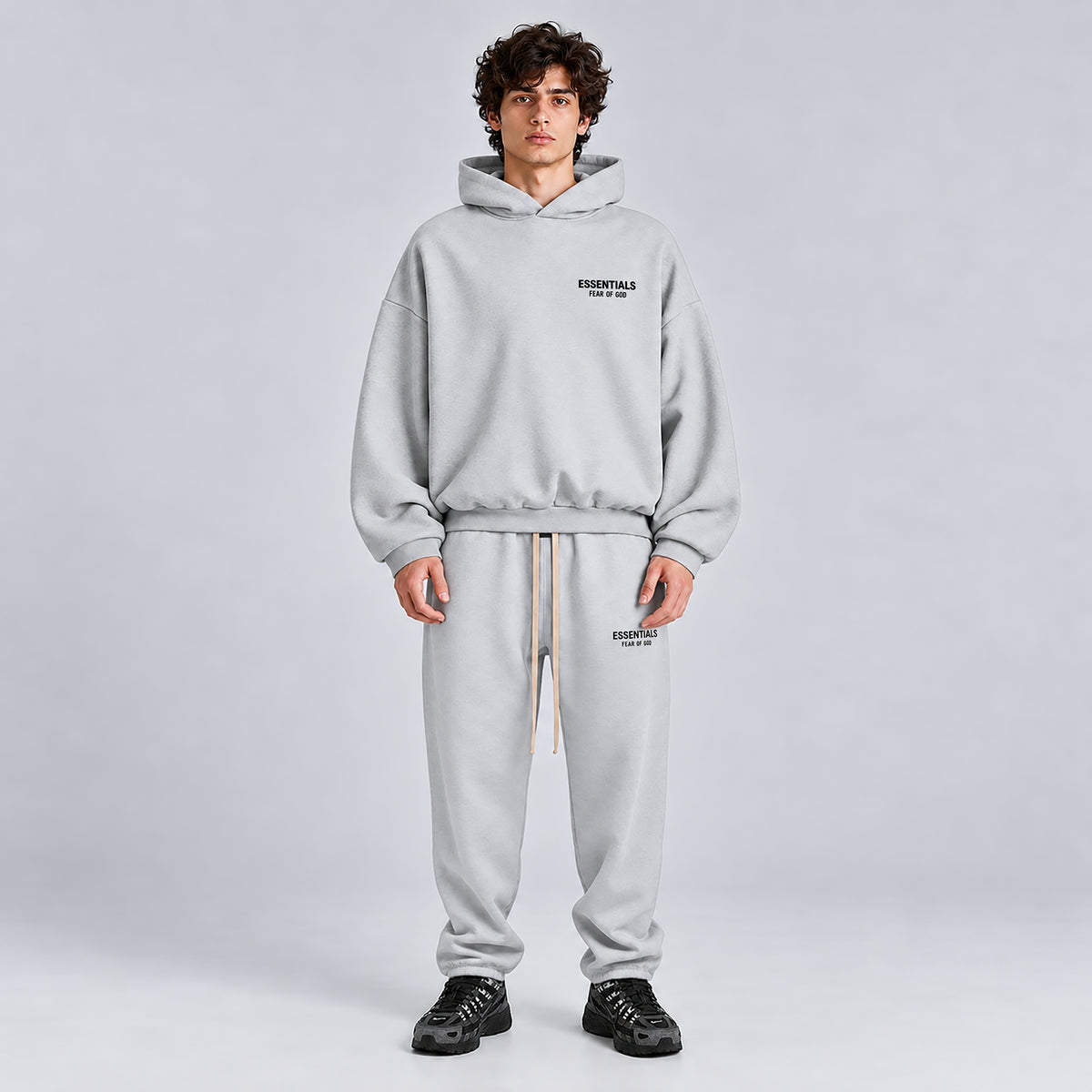 Fear of God Essentials Light Heather Grey Tracksuit FW24 worn together from the front