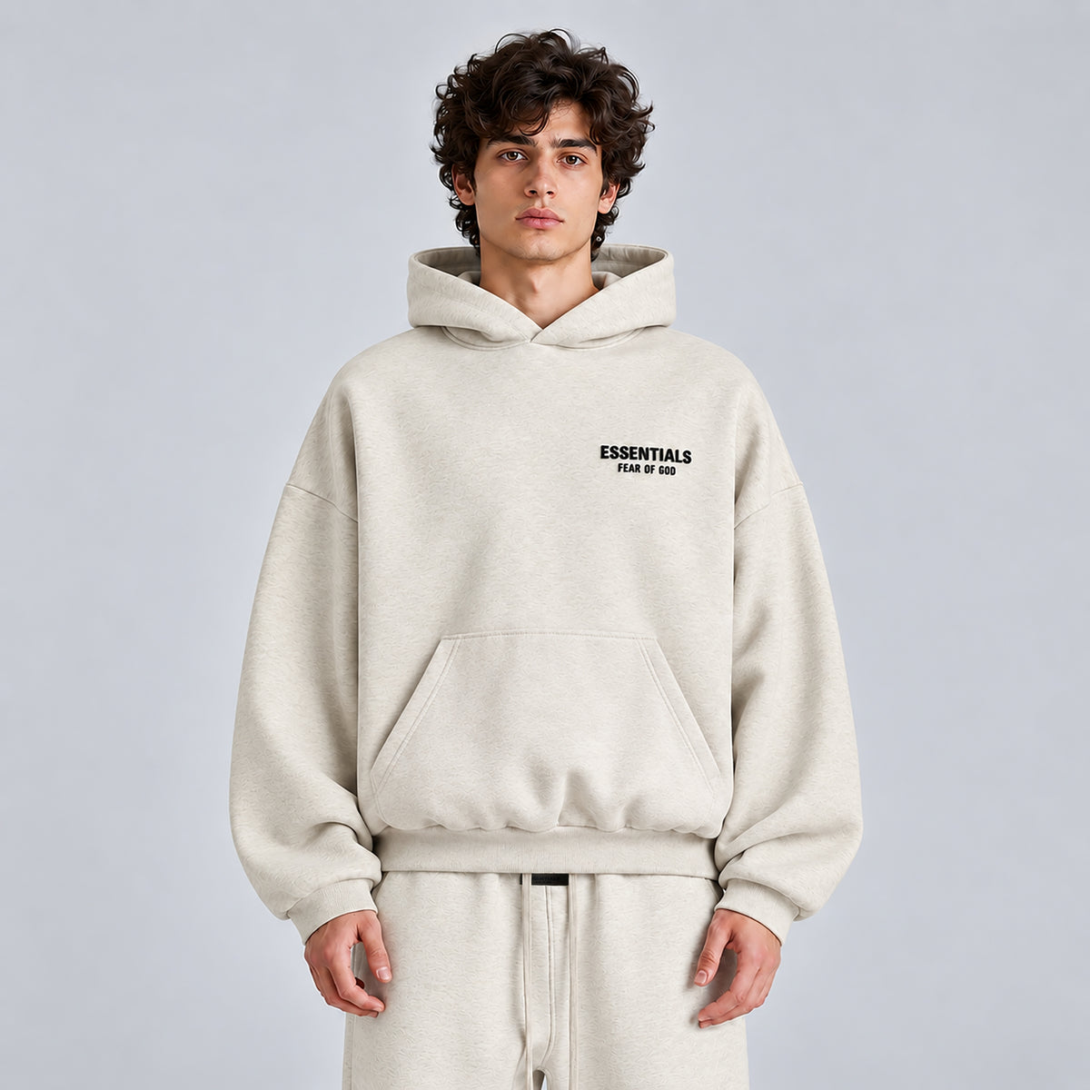 Front view of Fear of God Essentials Light Heather Oatmeal SS22 hoodie