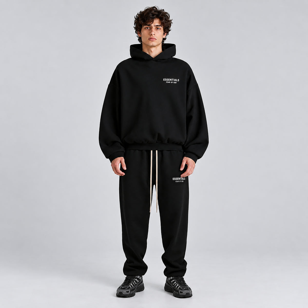 Fear of God Essentials Tracksuit Black FW24 worn as a complete matching outfit