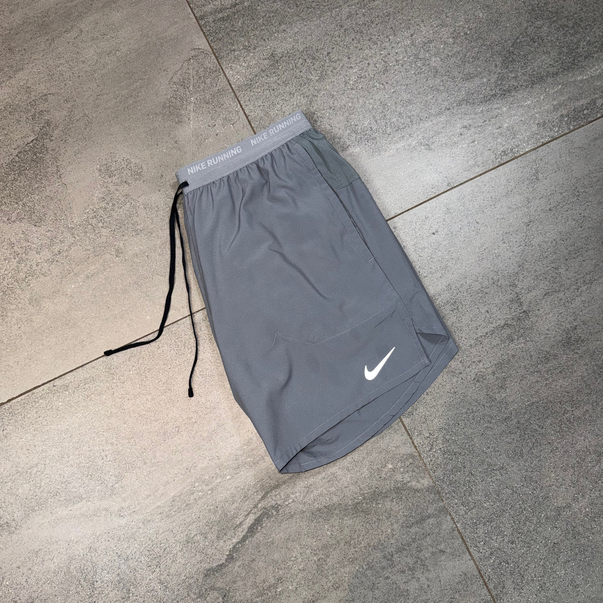 Grey Nike Flex Stride training shorts with drawcord