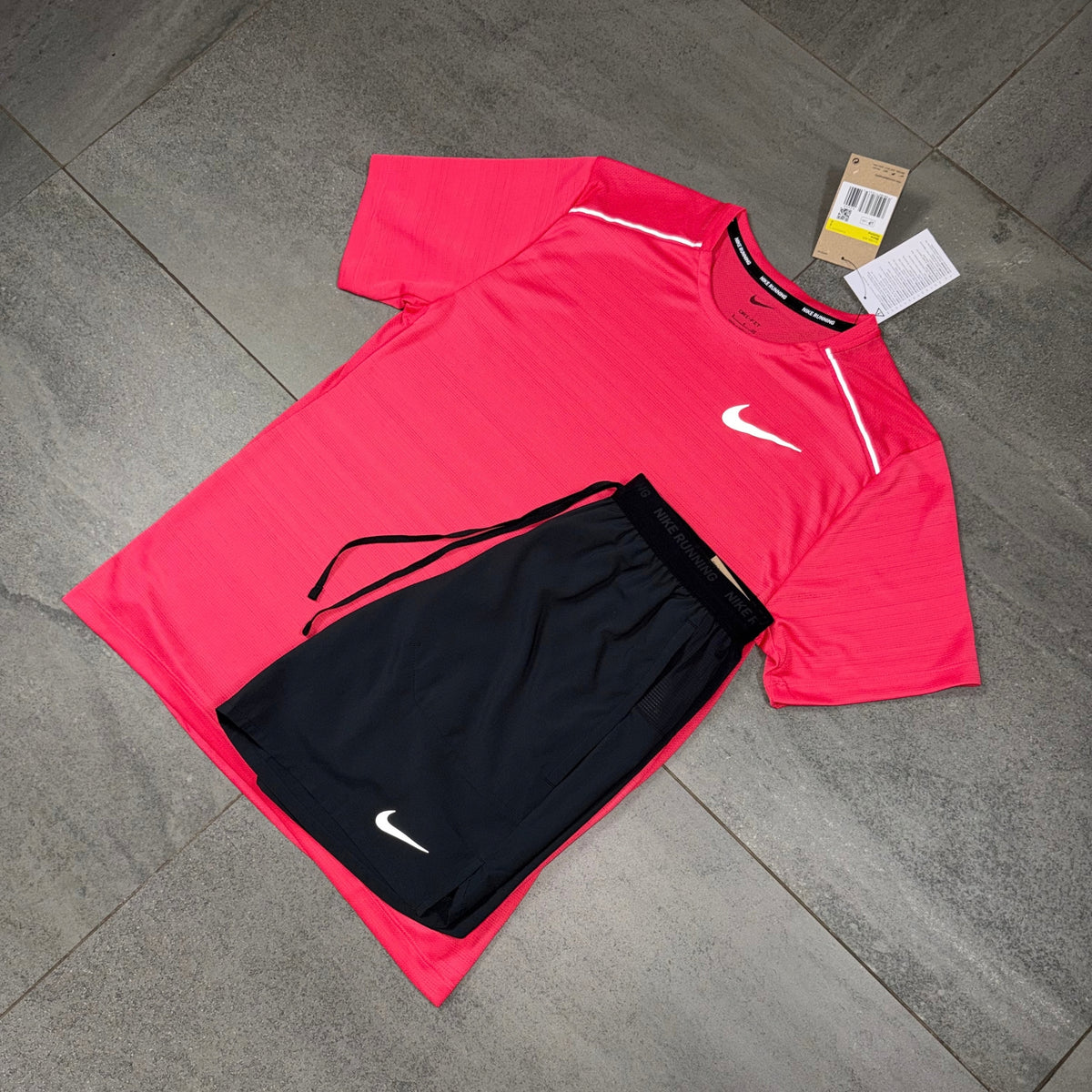Nike Aster Pink Miler T-Shirt with Black Flex Stride Shorts flat lay