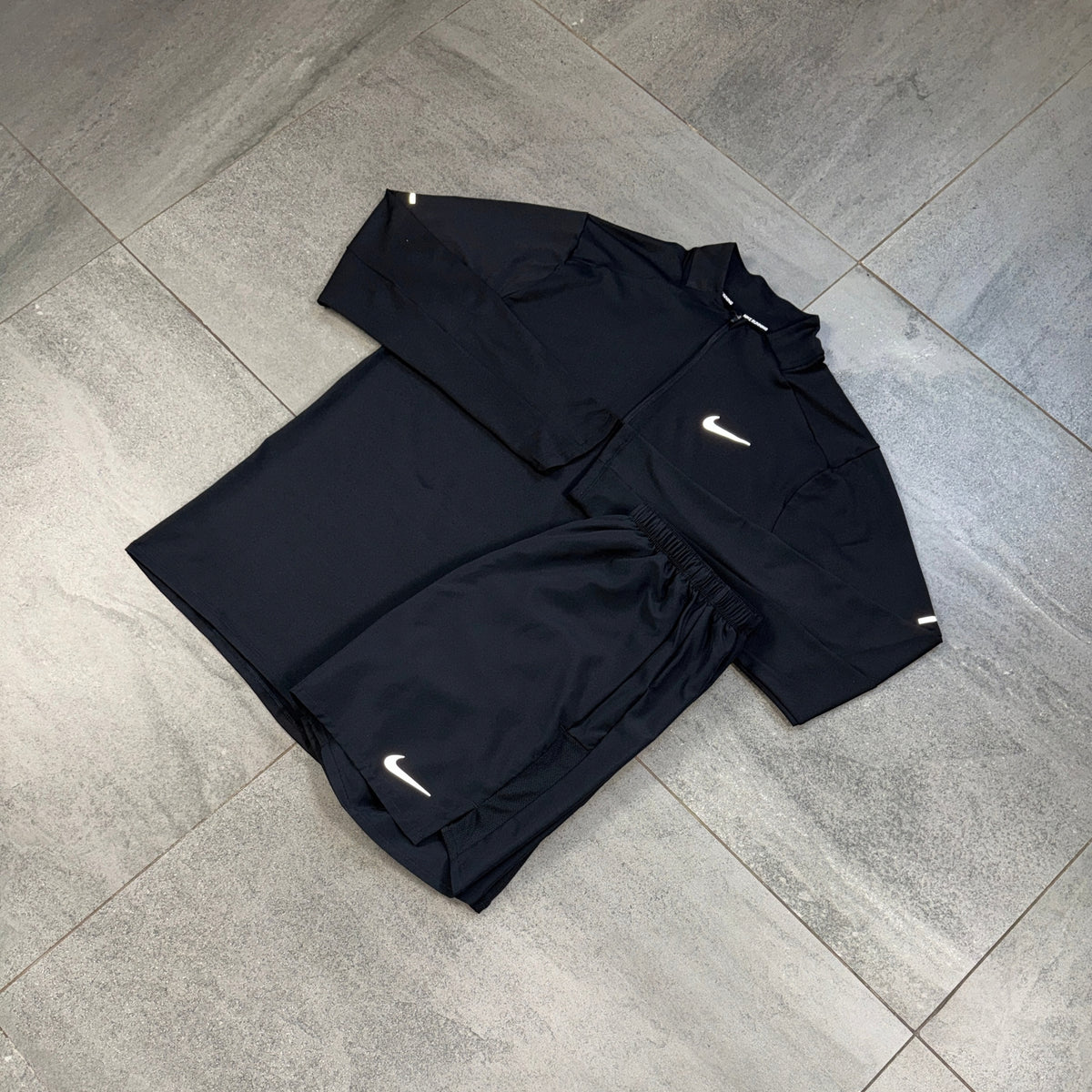 Nike Challenger Shorts and Element Black running top displayed together