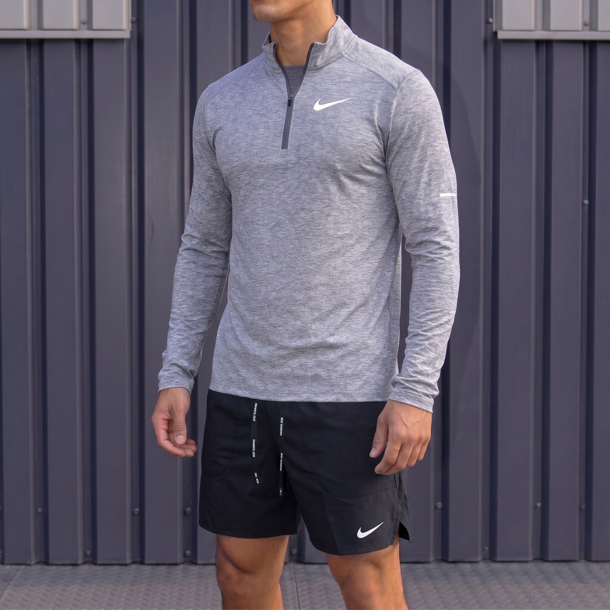 Nike Element Grey Running Top and Black Flex Shorts Set worn by model