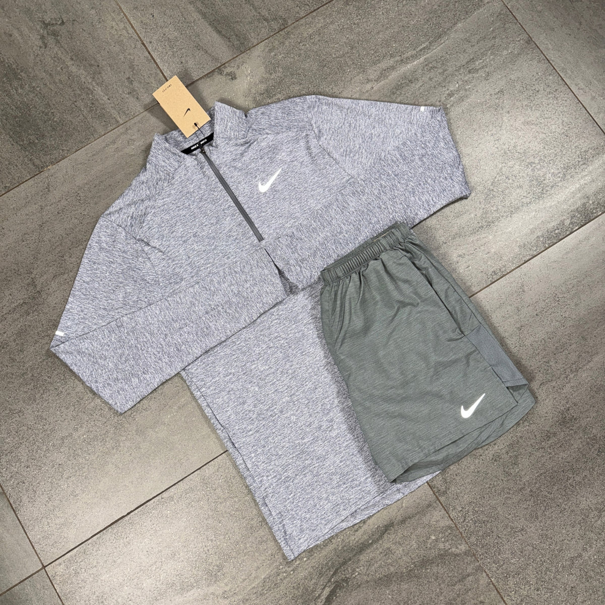 Nike Grey Running Top and Challenger Shorts Set displayed flat