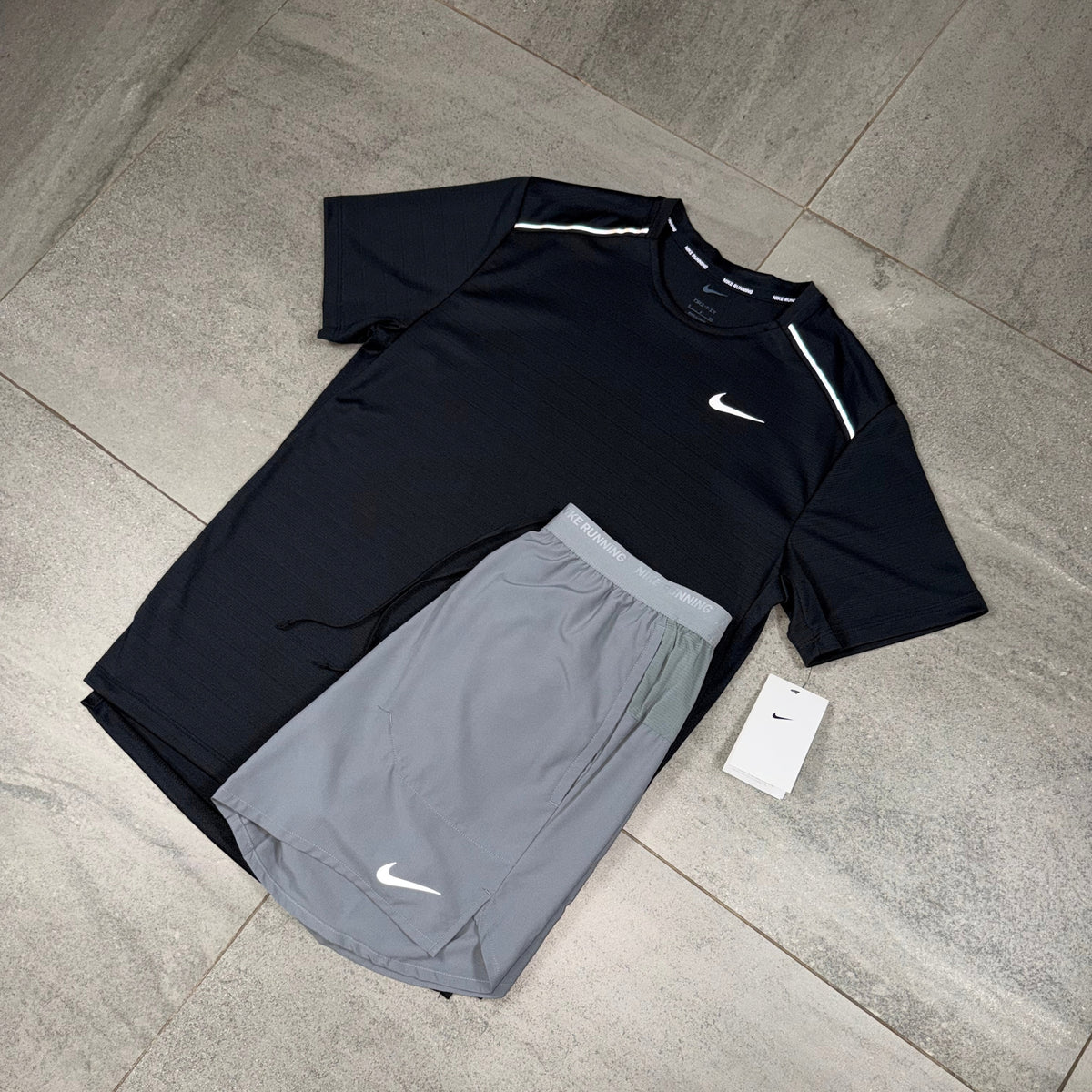 Men's Nike running outfit featuring a black Miler T-shirt and grey Flex Stride performance shorts