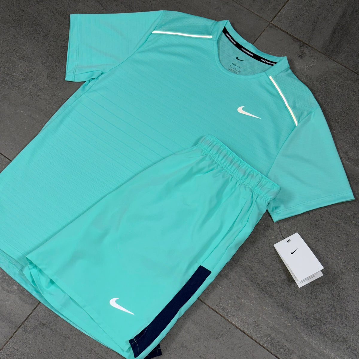 Nike Miler shirt and Challenger shorts in Hyper Turquoise arranged as a lightweight gym and training set