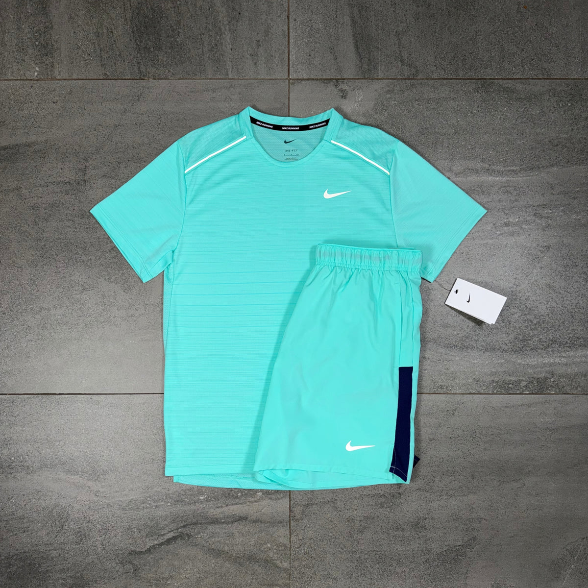 Nike Miler Hyper Turquoise T-shirt and Challenger shorts displayed together as a matching running outfit