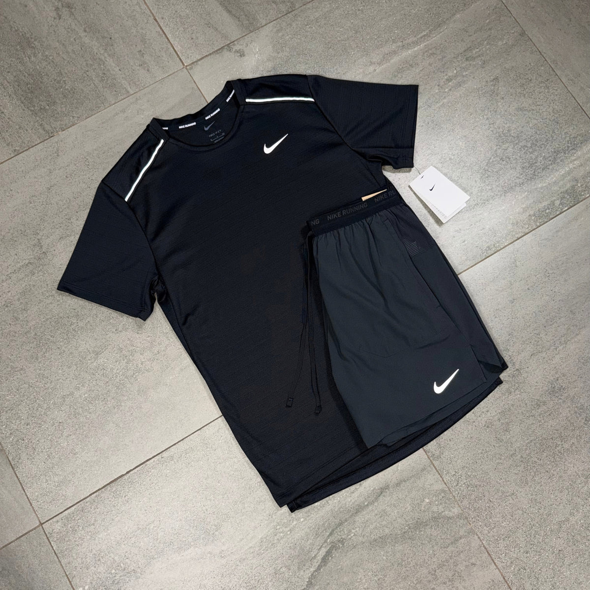 Men's black Nike gym outfit displaying the Miler running top alongside Flex Stride shorts