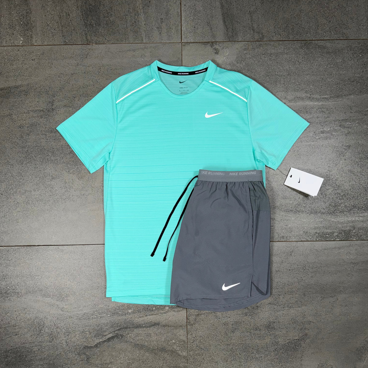 Nike Miler Hyper Turquoise T-shirt paired with grey Flex Stride shorts as a men's running outfit