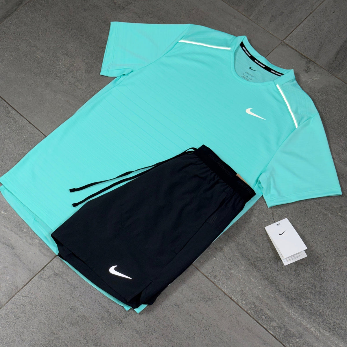 Nike Miler Hyper Turquoise T-Shirt and black Flex Stride shorts shown in a flat lay product view