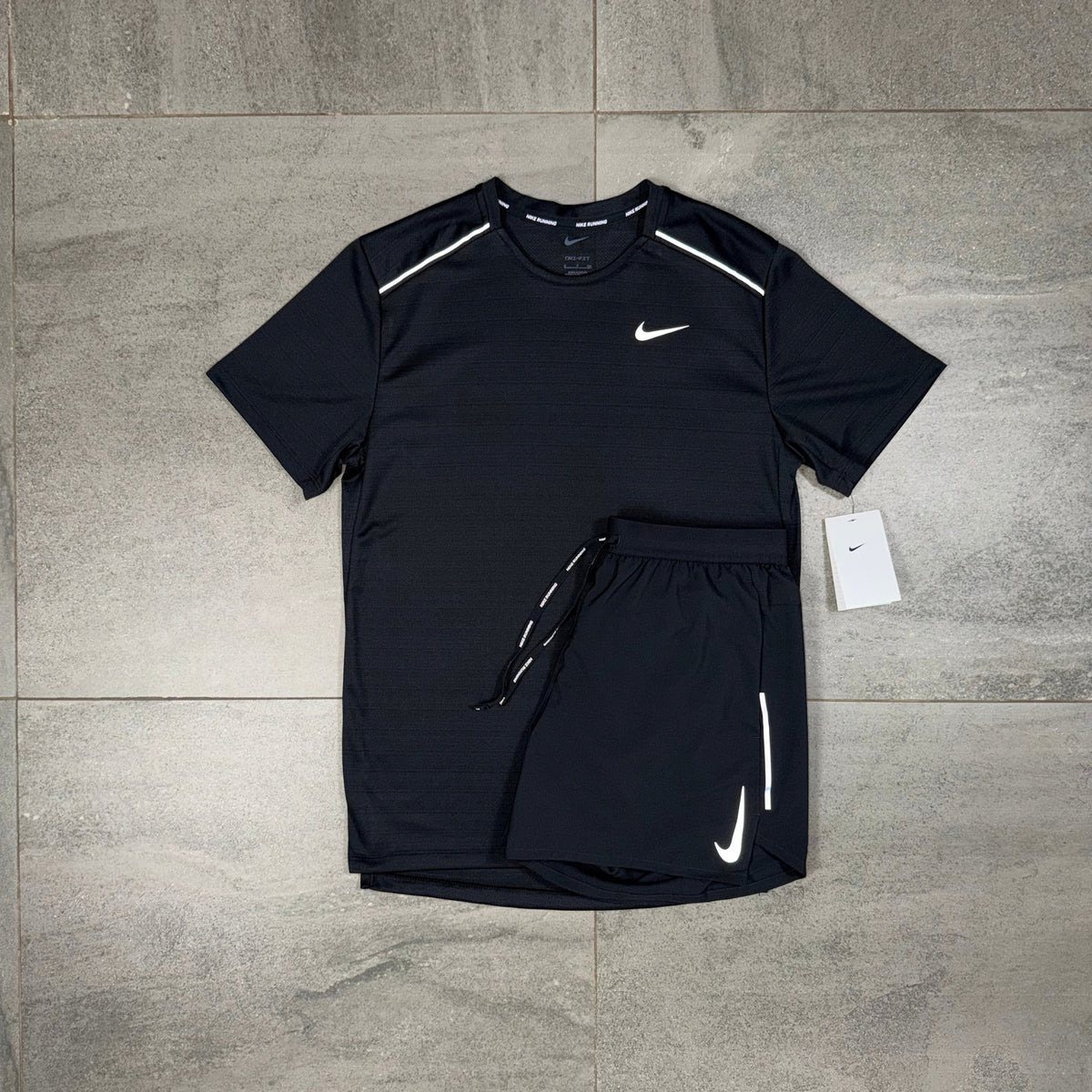 Nike Miler Black T-shirt and OG Flex Shorts displayed together as a matching men's activewear set