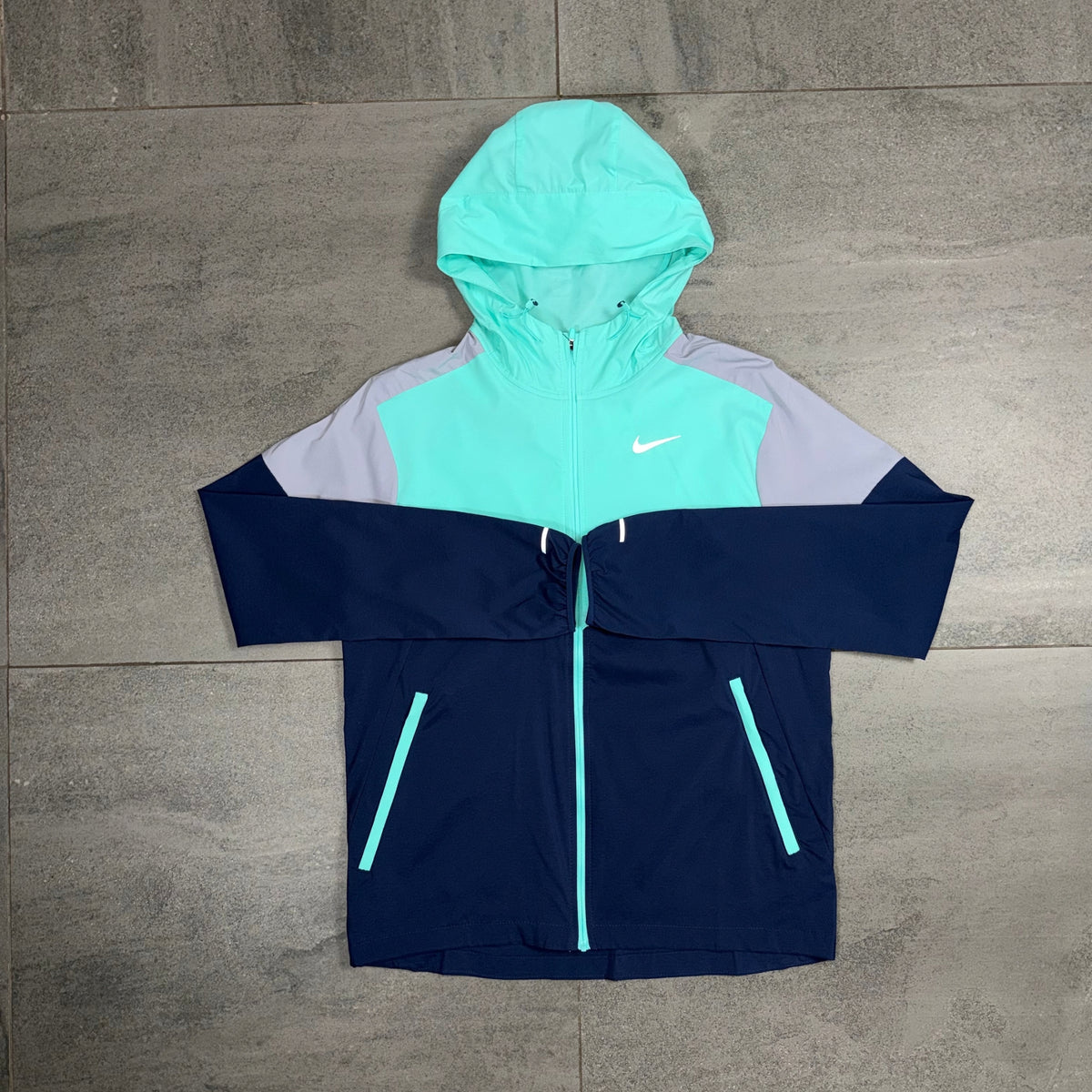 Nike Windrunner Hyper Turquoise and Navy Jacket with Black running shorts