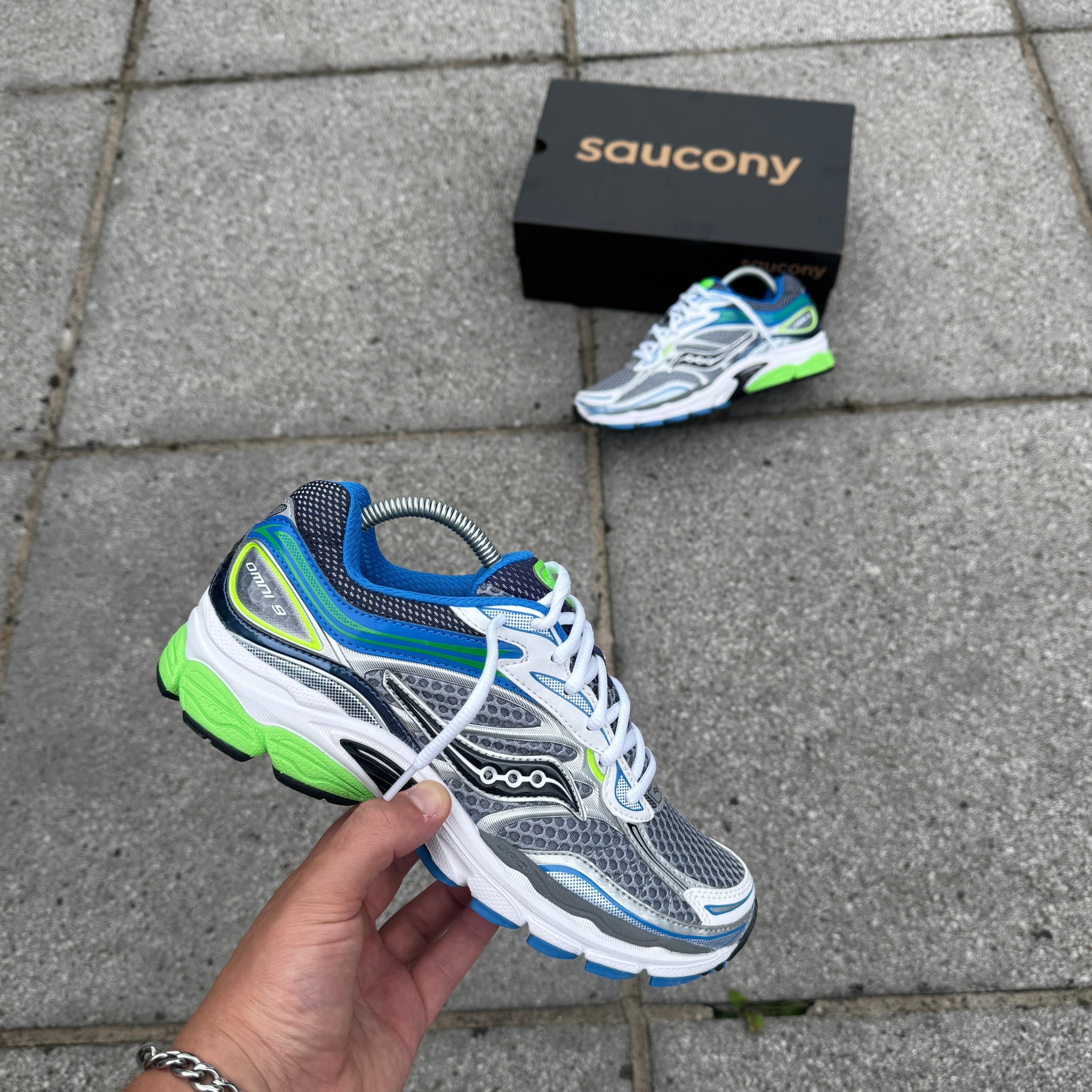 Side view of Saucony ProGrid Omni 9 Grey Slime Blue trainers