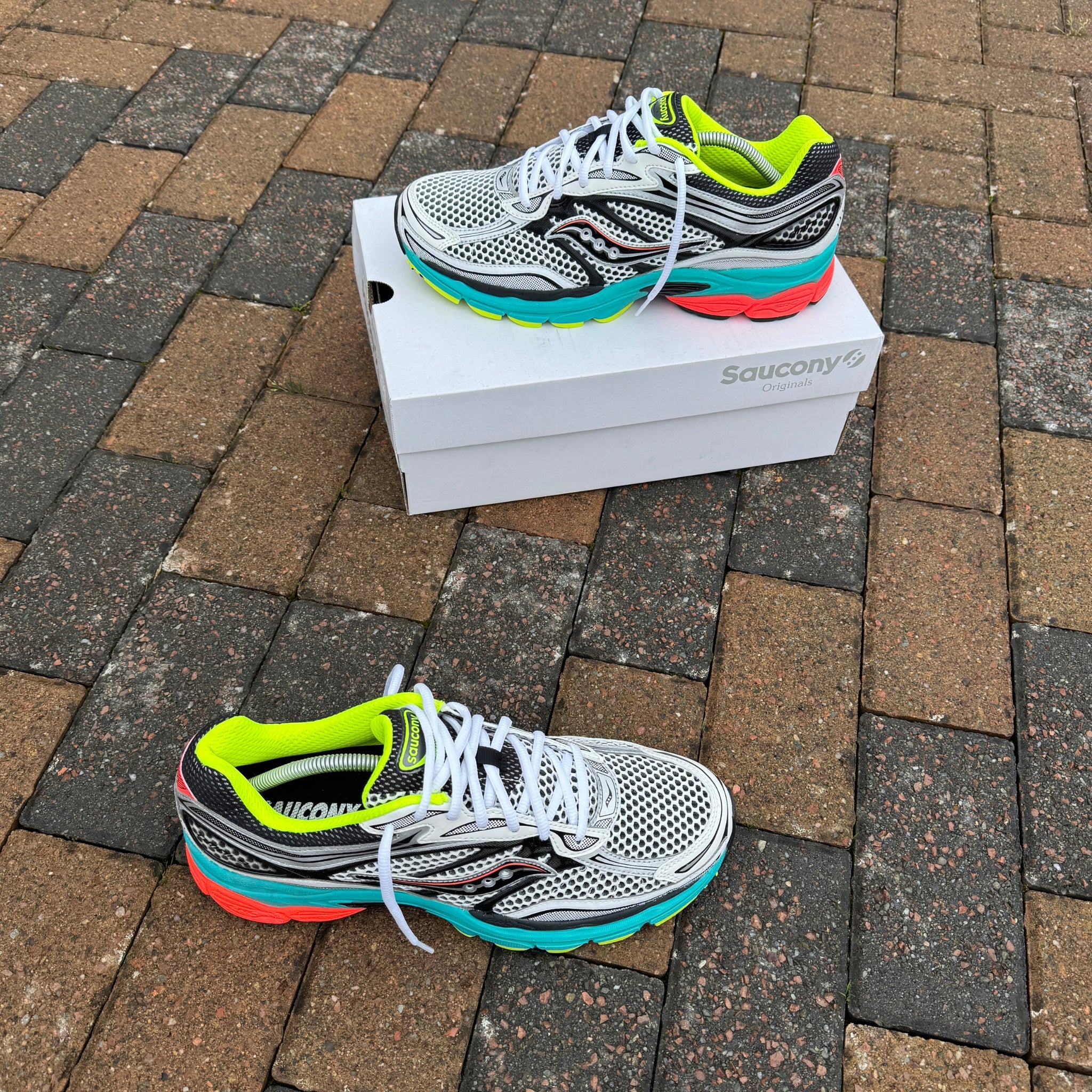 Pair of Saucony ProGrid Omni 9 Silver Mutant trainers