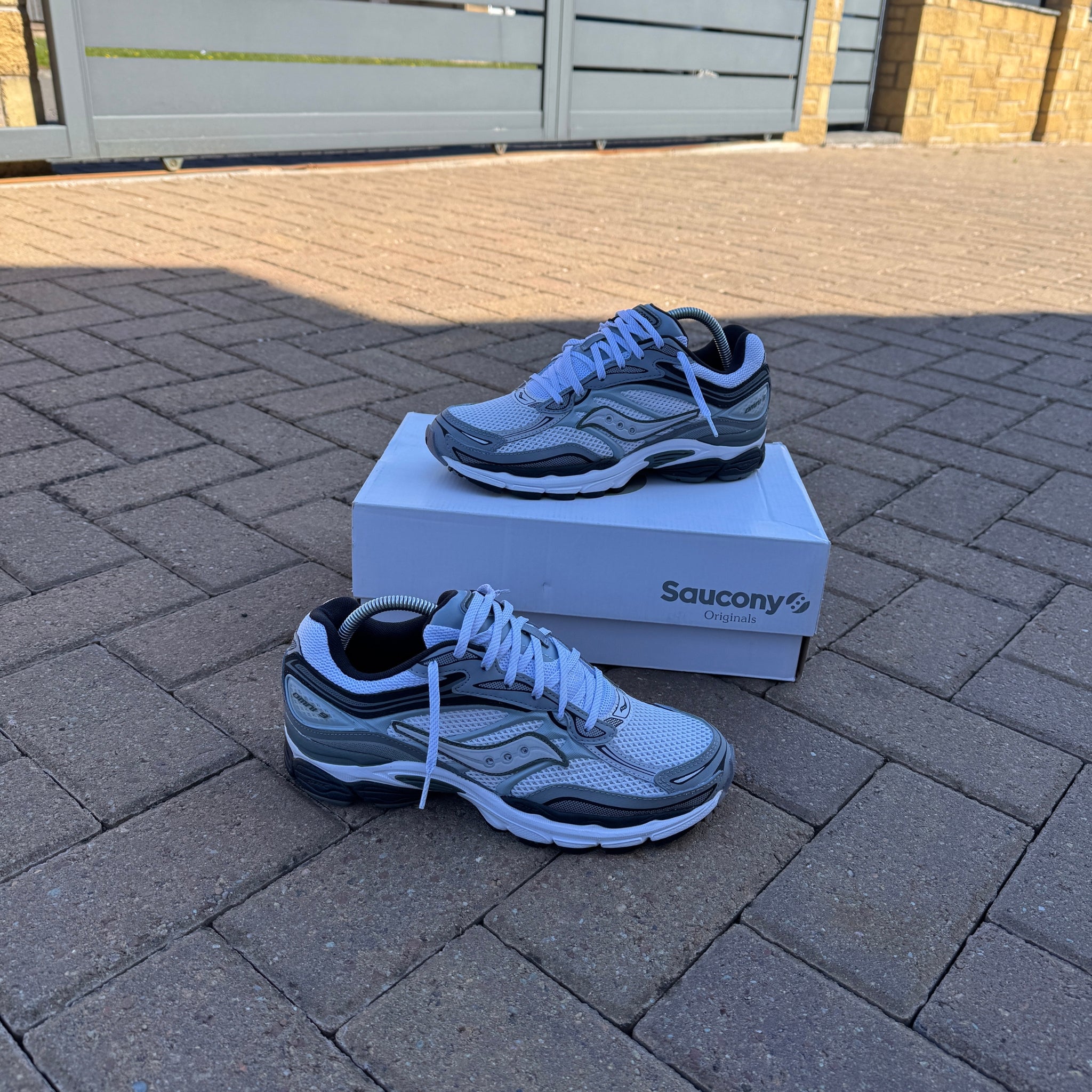 Pair of Saucony ProGrid Omni 9 White Grey trainers