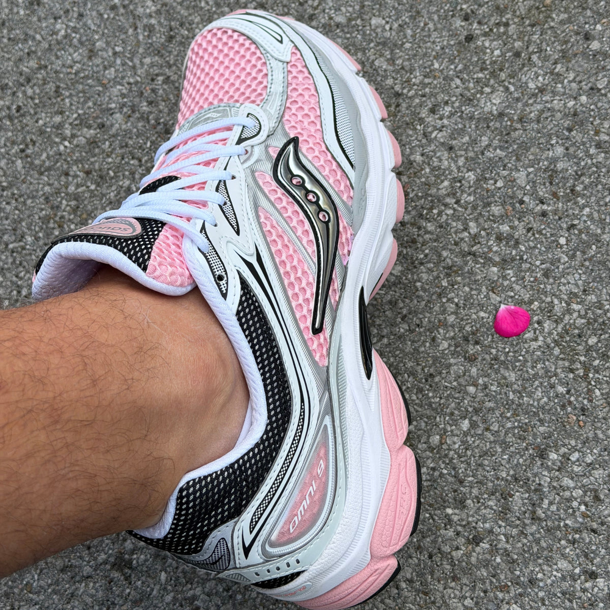 Side view of Saucony ProGrid Omni 9 White Touch pink trainers
